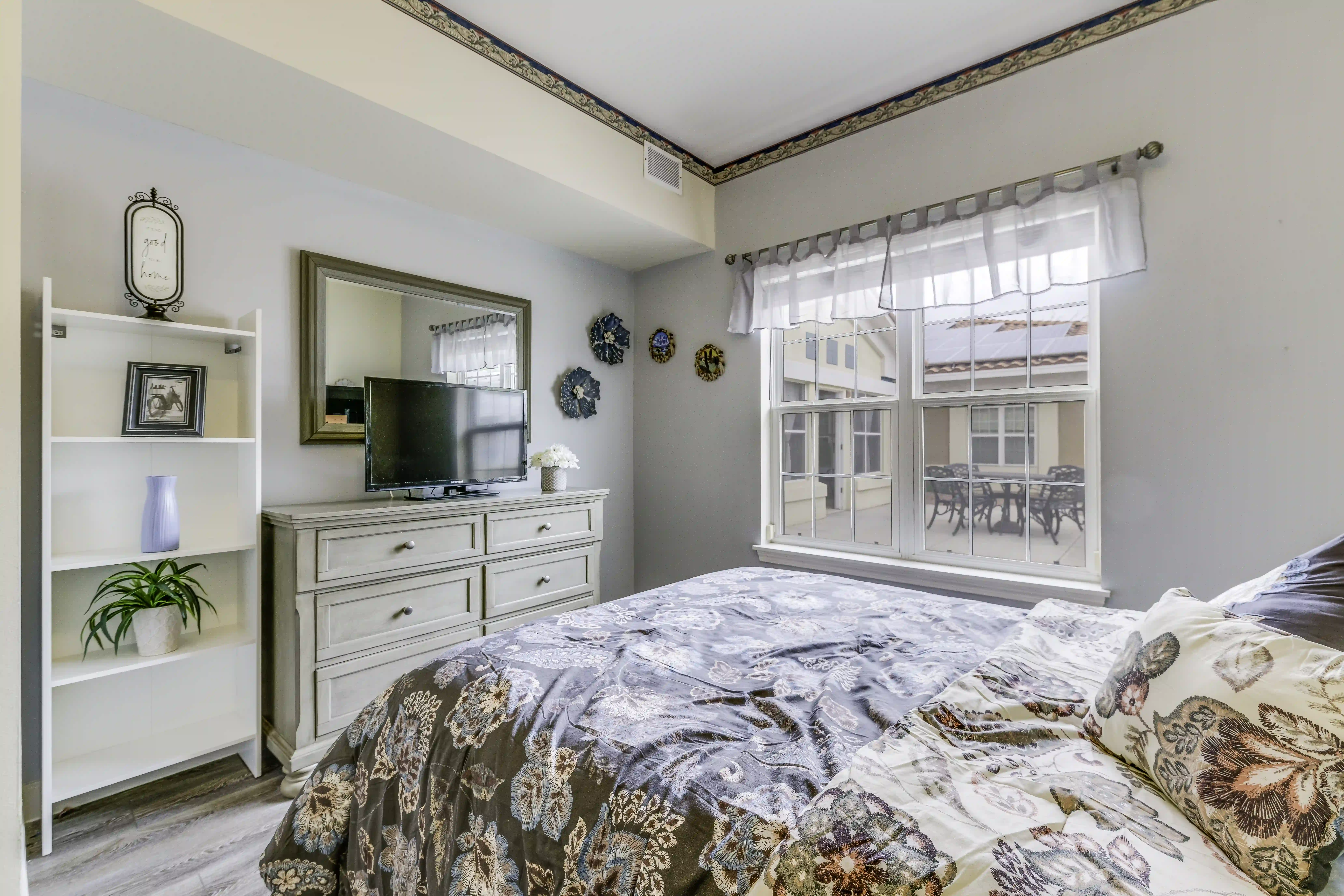 Spring Valley Memory Care model bedroom with patio view