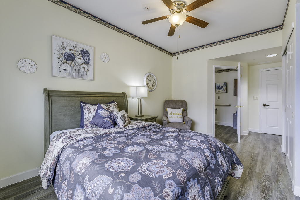Spring Valley Memory Care model bedroom with patio view